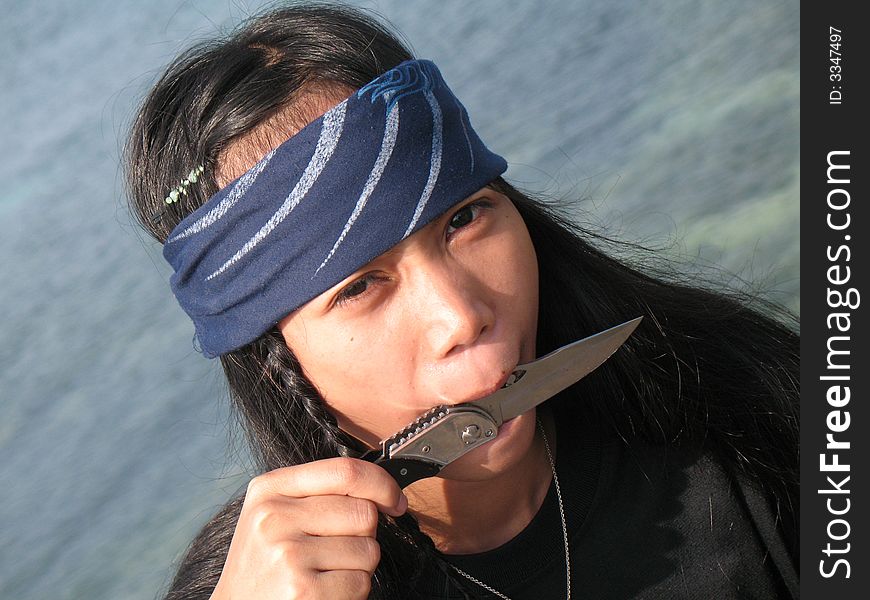 Pirate girl in south of Philippines on the rock. Pirate girl in south of Philippines on the rock