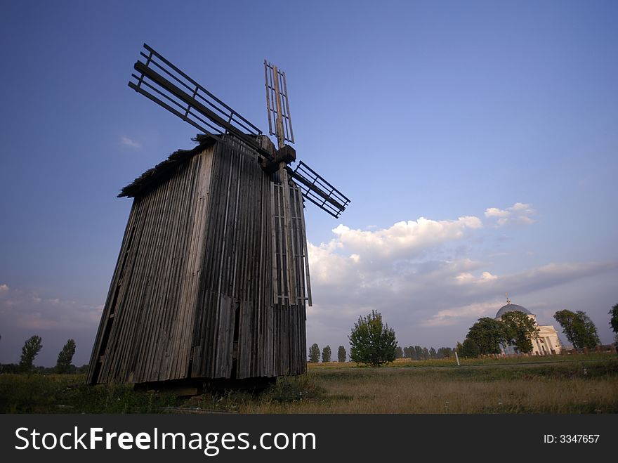 Windmill and a blue sky and nature as a background