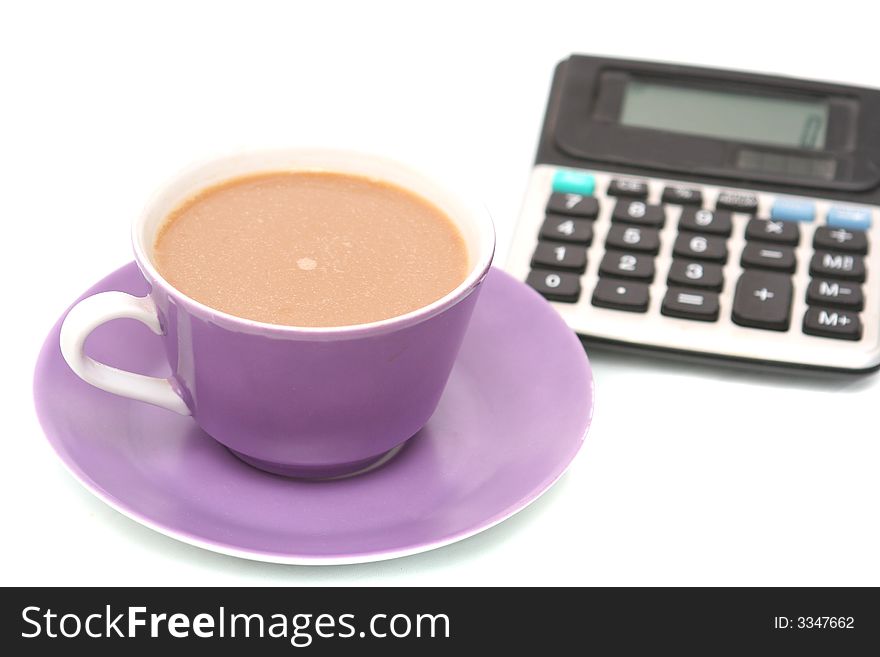 Cup from coffee and the calculator on a white background