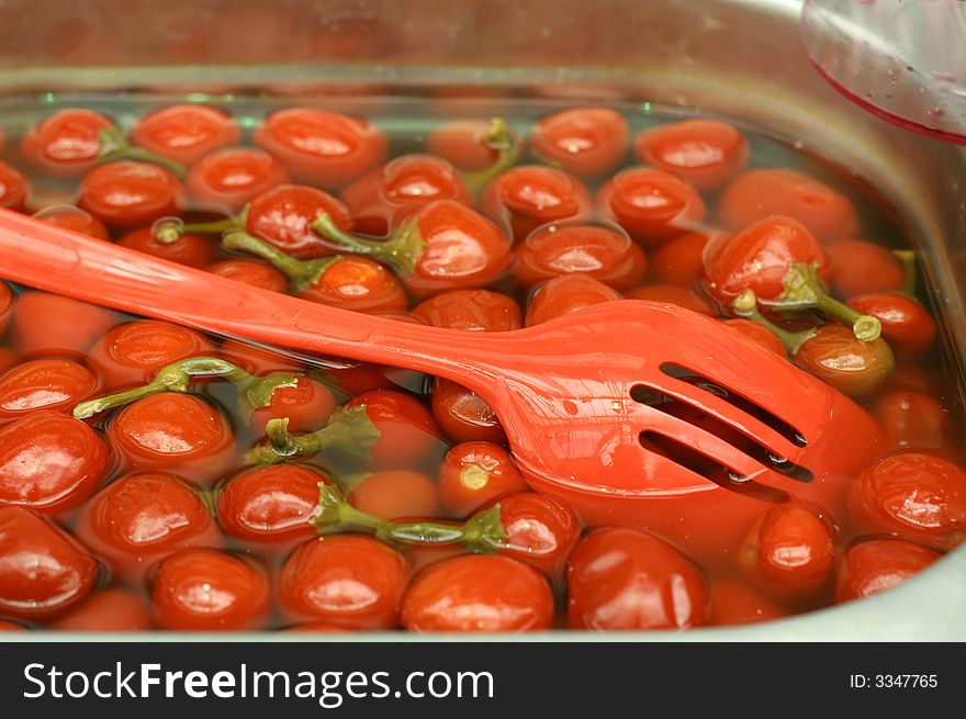 Red marinated tomatoes in market