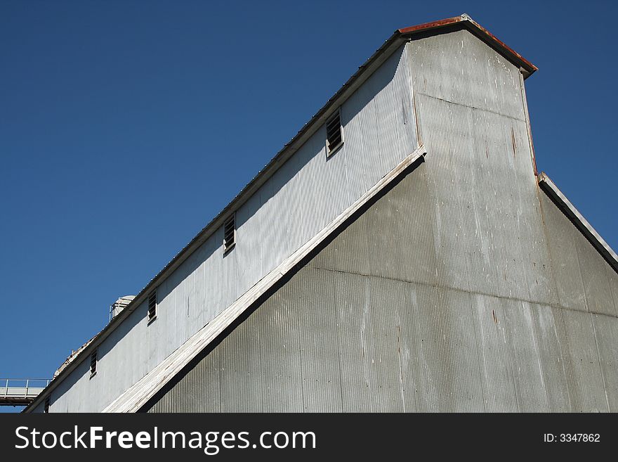 A Peanut Processing Plant against a blue sky