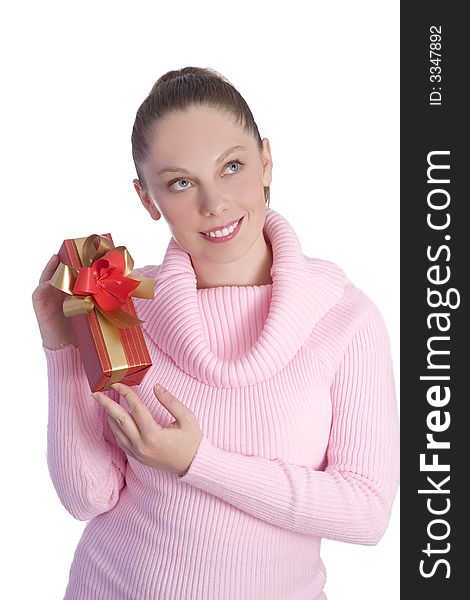 Beautiful young girl in pink holding red gift isolated on white background. Beautiful young girl in pink holding red gift isolated on white background