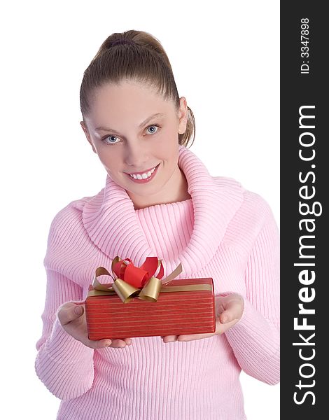 Beautiful young girl in pink holding red gift isolated on white background. Beautiful young girl in pink holding red gift isolated on white background