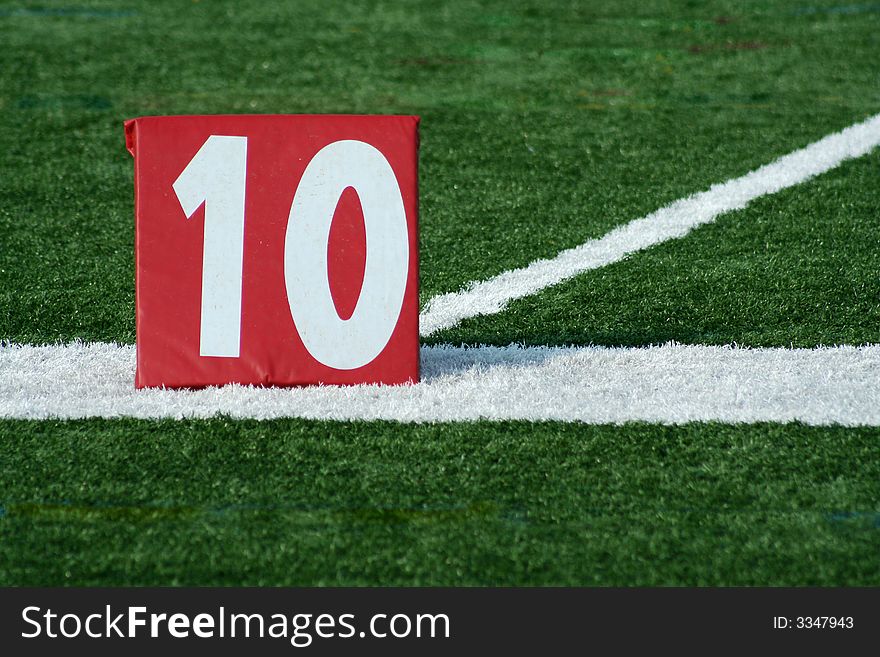 A red Football ten yard marker