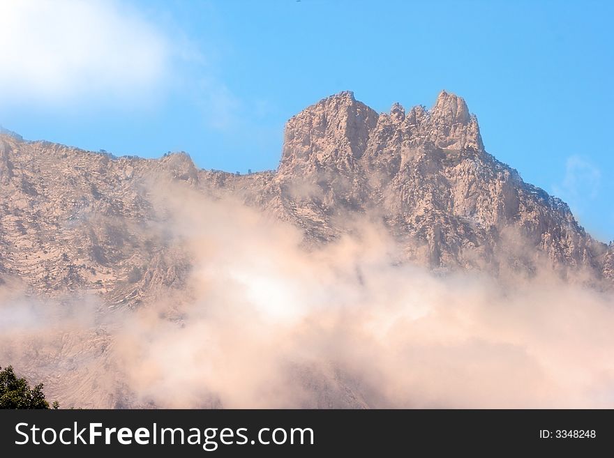 Sky with clouds under mountain