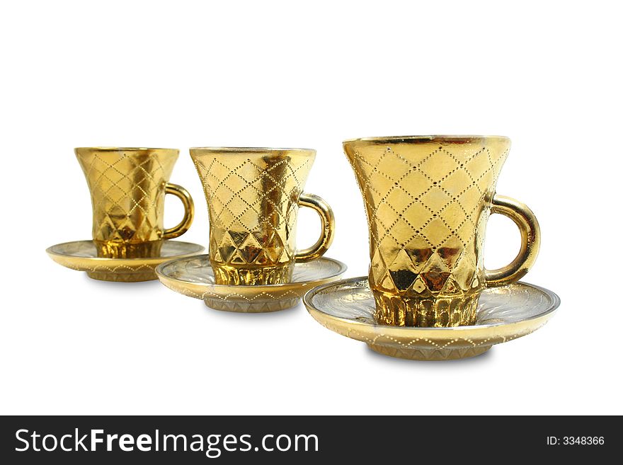 Three isolated gilt cups in a row. Three isolated gilt cups in a row