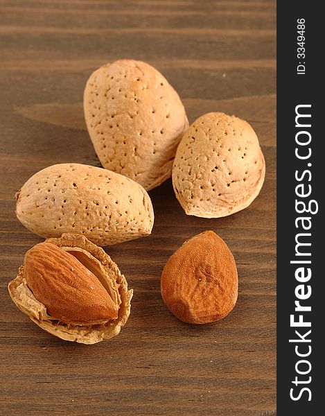 Group of almonds with background of wood