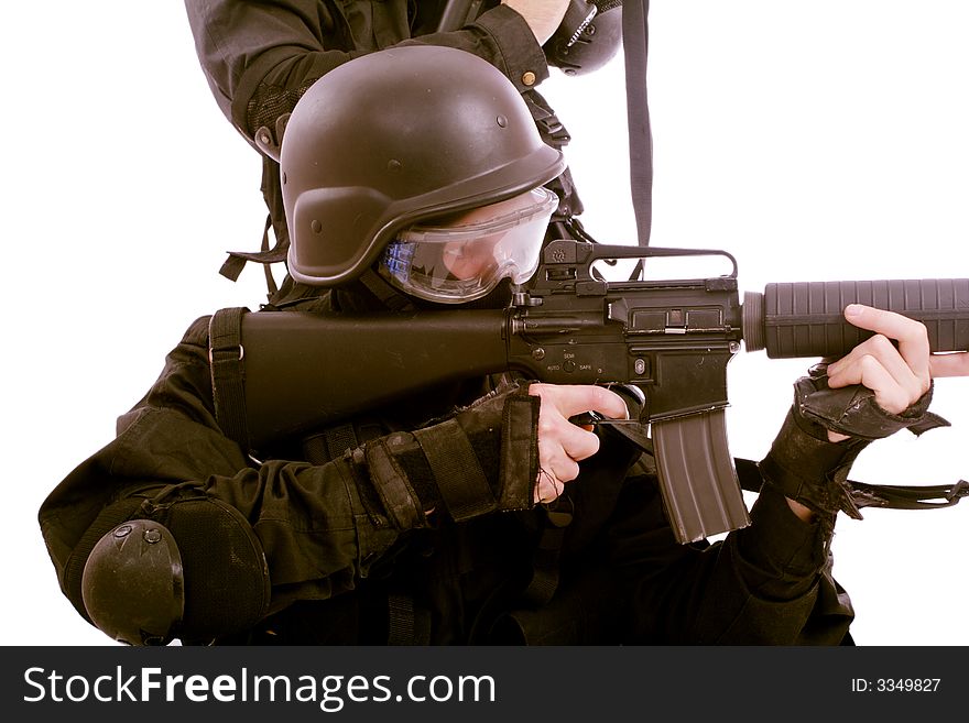 Shot of a soldier holding gun. Uniform conforms to special services(soldiers) of the NATO countries. Shot of a soldier holding gun. Uniform conforms to special services(soldiers) of the NATO countries.