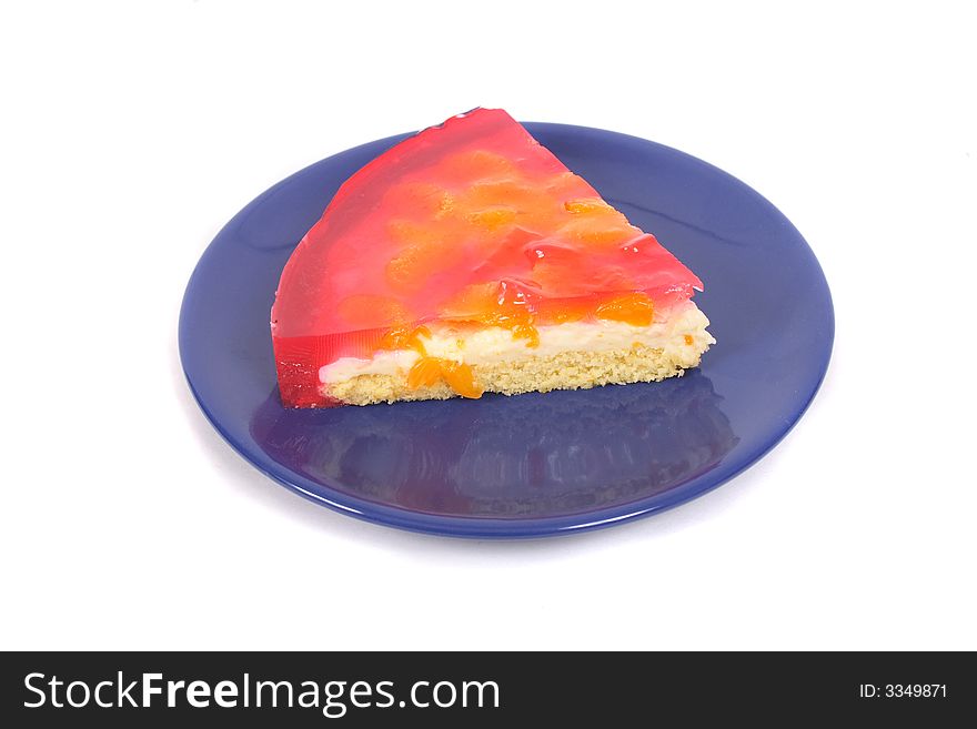 Sweet red and yellow desert on the blue plate. Sweet red and yellow desert on the blue plate