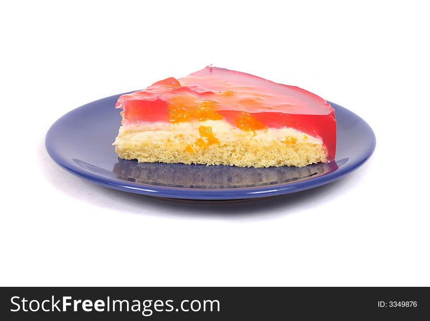Sweet red and yellow desert on the blue plate. Sweet red and yellow desert on the blue plate