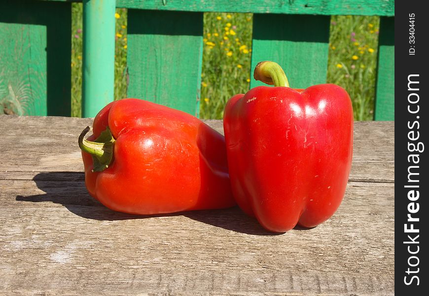 Two Red Peppers On Table