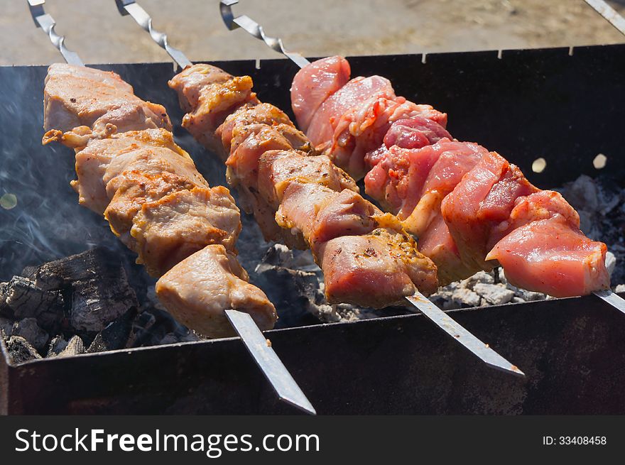 Roasted kebabs on the grill outdoors