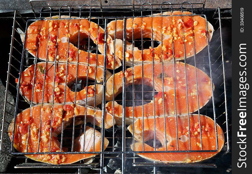 The fish Salman baked on a mangal at the decaying corner. The fish Salman baked on a mangal at the decaying corner