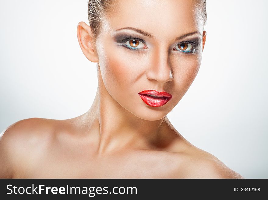 Portrait of beautiful woman with makeup on white background