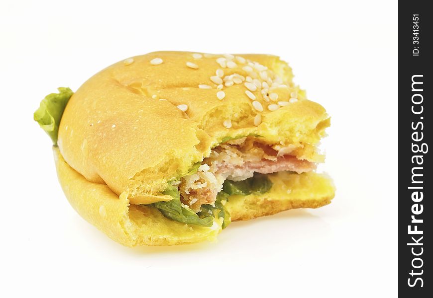 Delicious bite of bolona burger bun on white background