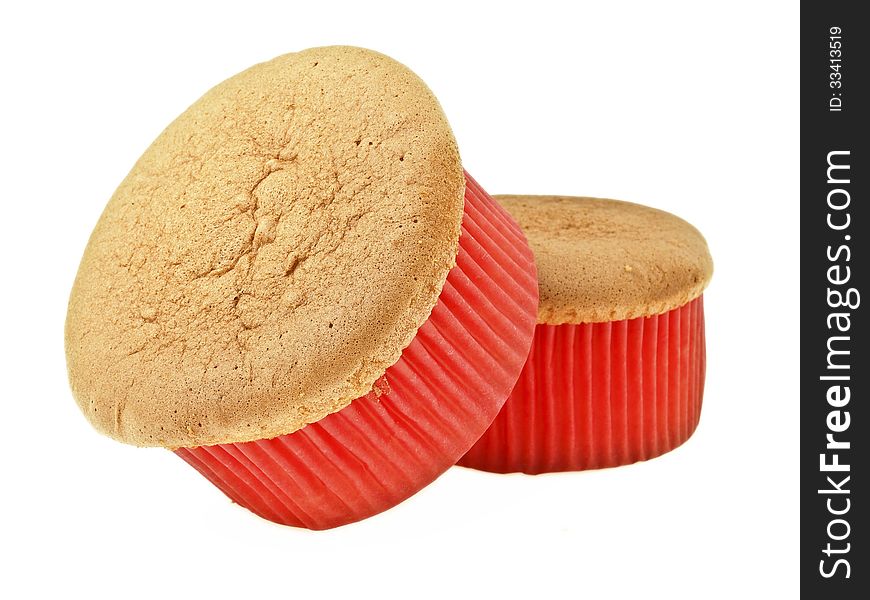 Pile of delicious sponge cake in red paper cup on white background. Pile of delicious sponge cake in red paper cup on white background