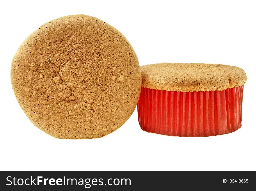 Two delicious sponge cake in red paper cup on white background. Two delicious sponge cake in red paper cup on white background