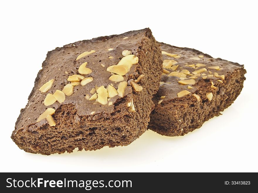 Pile of delicious almonds brownies on white background. Pile of delicious almonds brownies on white background