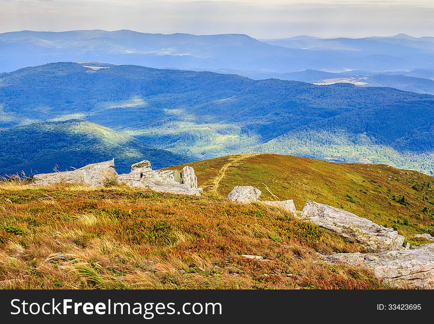 Footpath at the hill top leading into mountains