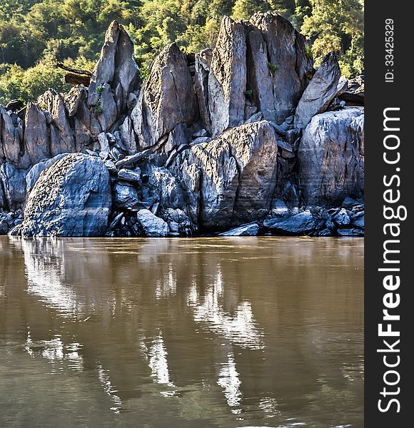 Rocks Reflections On Mekong River