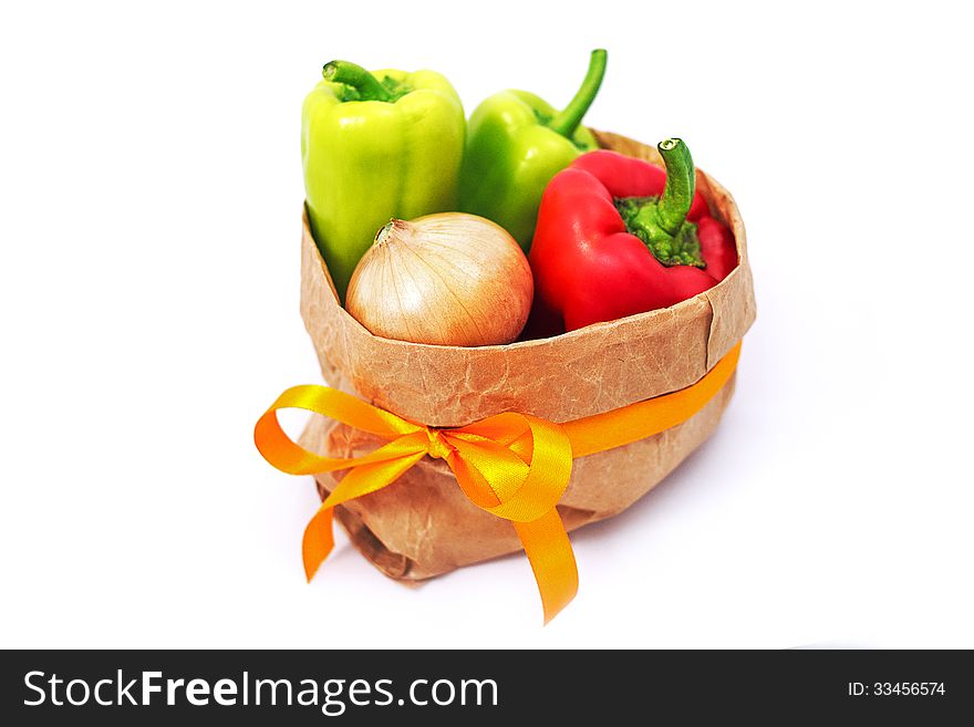 Grocery bag with paprica and onion isolated on white. Grocery bag with paprica and onion isolated on white