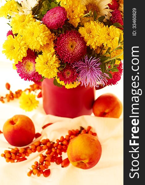 Still life with autumnal flowers and fruits. Still life with autumnal flowers and fruits