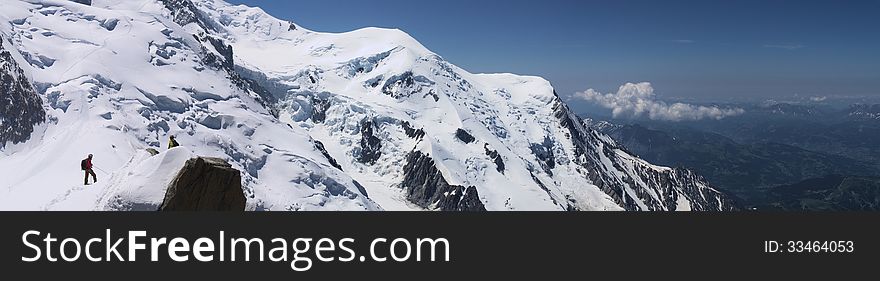 Snow peaks of Mont-Blanc mountain massive, close, panoramic. Chamonix, France. Taken in July 2013. Snow peaks of Mont-Blanc mountain massive, close, panoramic. Chamonix, France. Taken in July 2013.