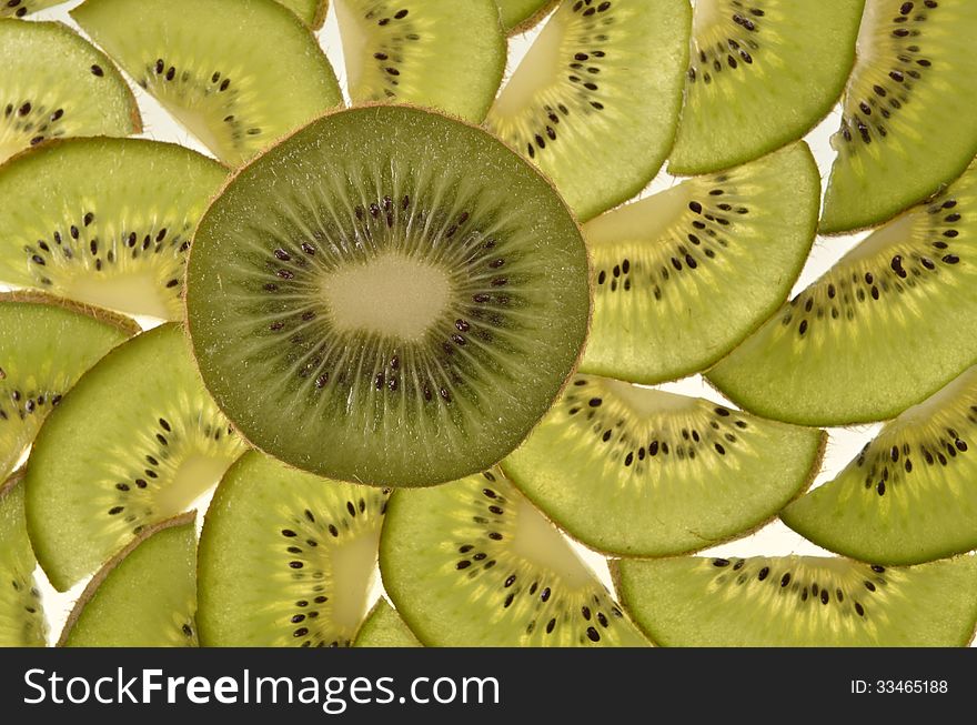 Half kiwi fruit on a background of the pieces