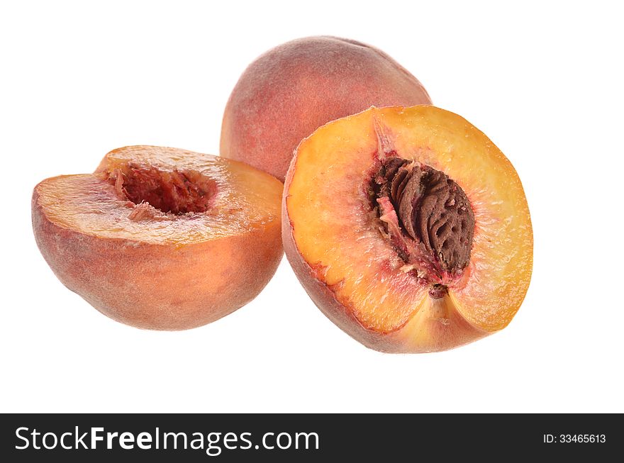 Two peach halves on a white background. Two peach halves on a white background