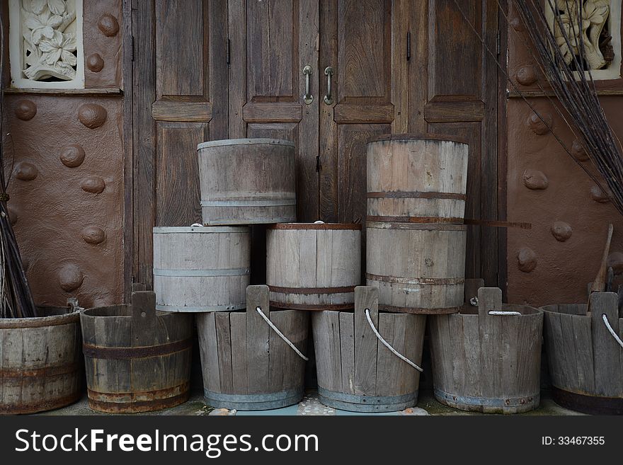 A wooden pail in the old home of the country in thailand.