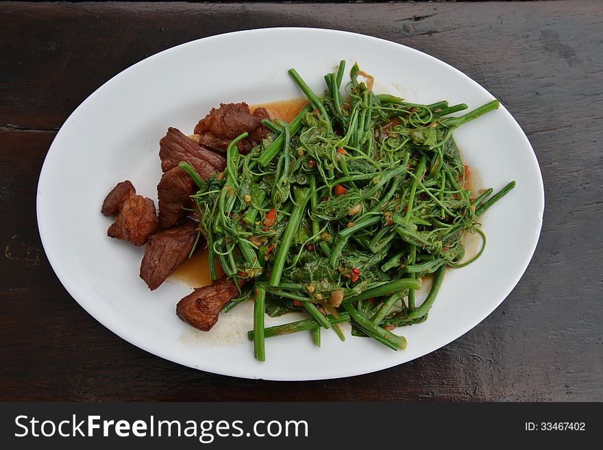 Stir fried with Oyster Sauce and pork.