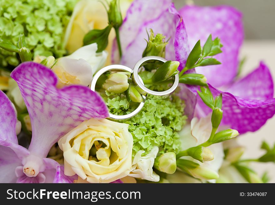 Two wedding rings and wedding background.