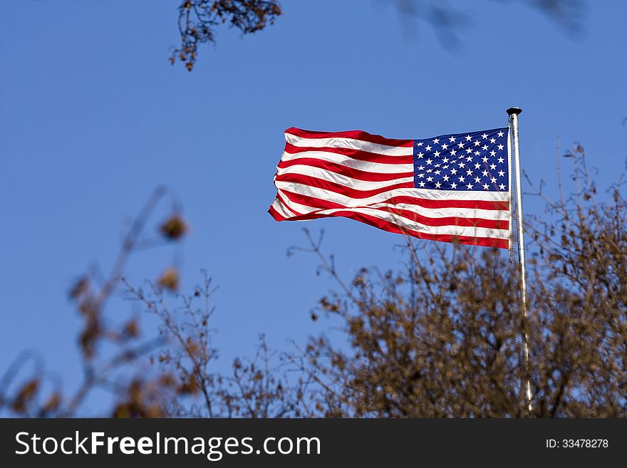 American flag on a background of blue sky