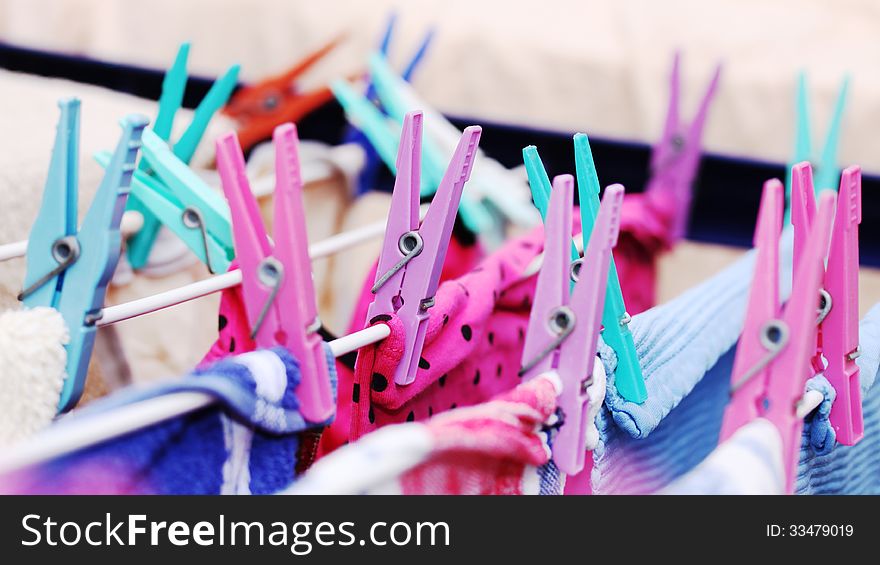 Colored plastic clamps for hanging up the washing