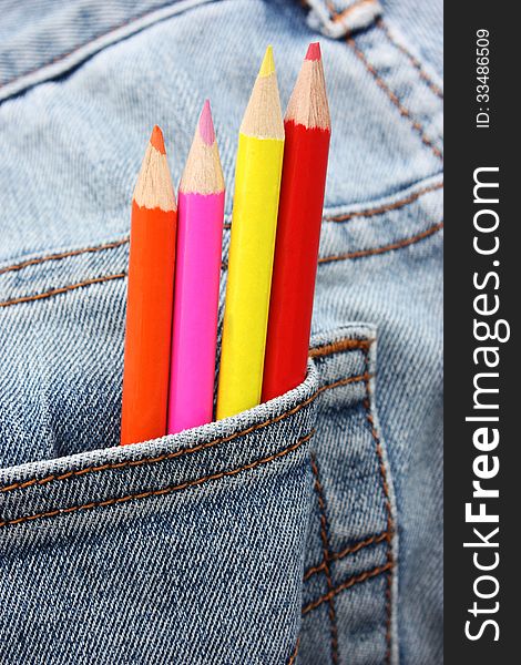 Colour pencils coming out from a pocket. Colour pencils coming out from a pocket