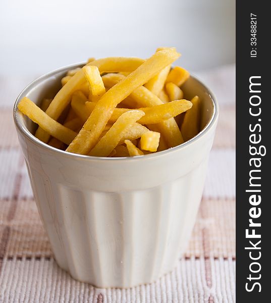 French Fries in white cup more fat