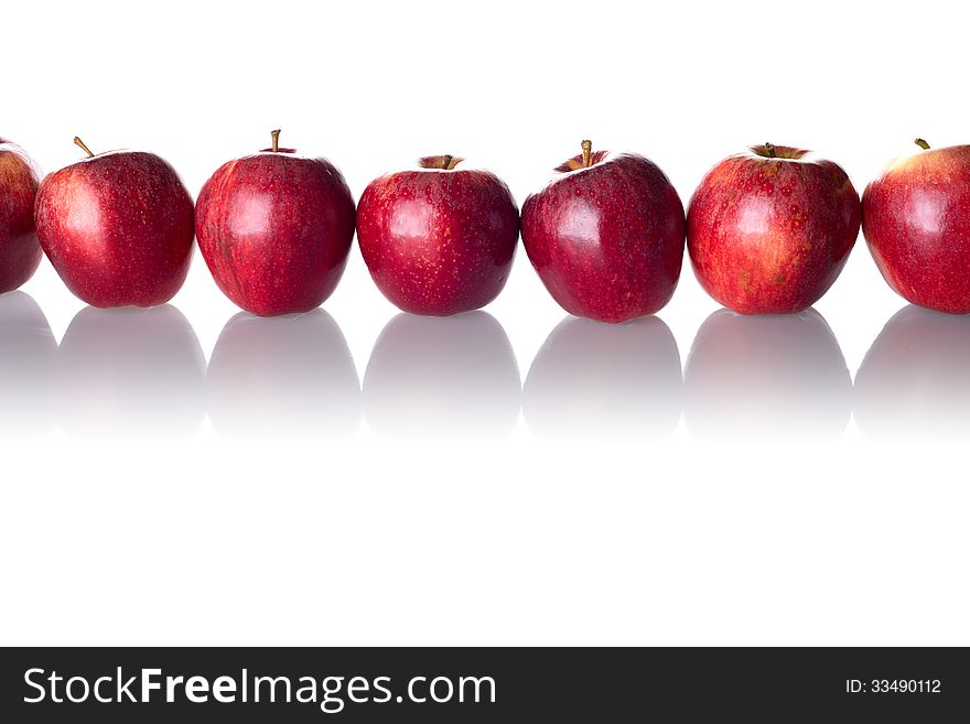 A line of apples isolated on white background.