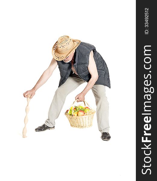 Elderly man with a basket of fruit and cane on white background