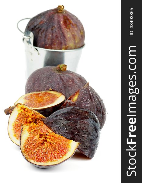 Arrangement of Ripe Figs Full Body and Slices in Tin Bucket isolated on white background