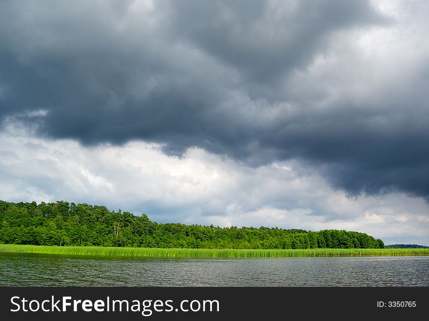 Moody sky over lake.