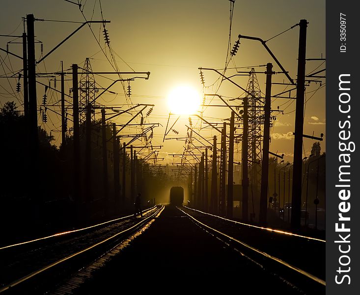 Railroad on the sunset. incoming train. Railroad on the sunset. incoming train
