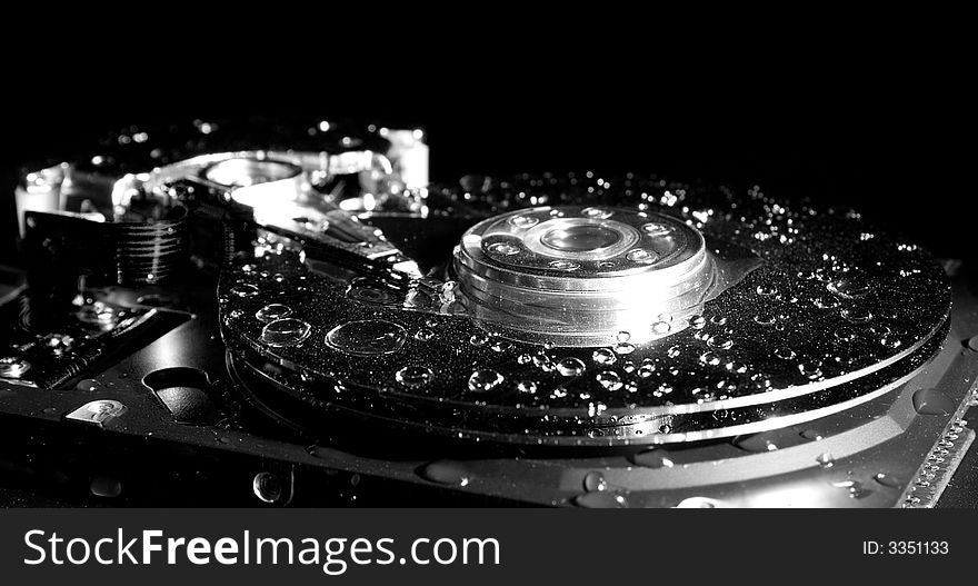 Closeup hard disk drive with water drops on it surface. Closeup hard disk drive with water drops on it surface