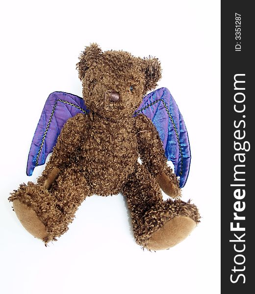 Soft toy bear, dressed for halloween with purple bat wings. Soft toy bear, dressed for halloween with purple bat wings