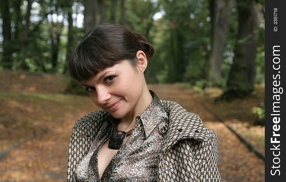 Beautiful woman walking in the autumn park. Beautiful woman walking in the autumn park