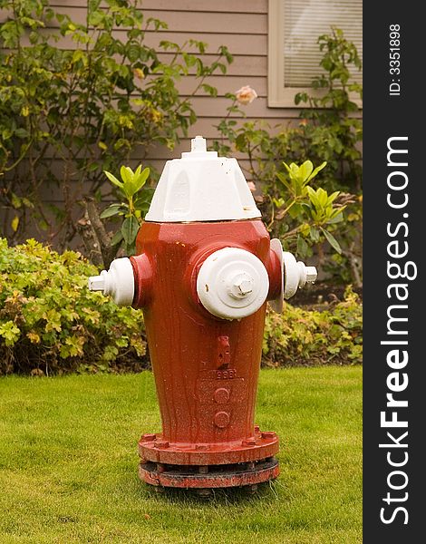 A new red and white fire hydrant. A new red and white fire hydrant