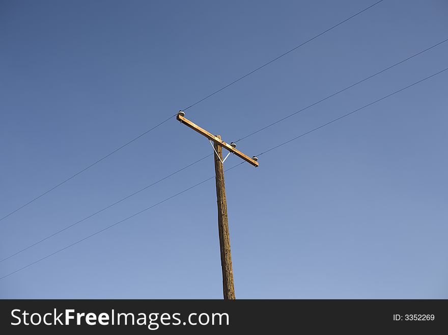 A power line against a blue sky