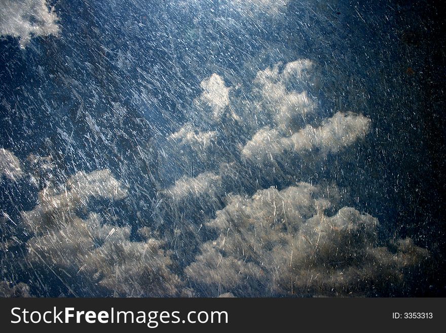 A scratched steel etching of dark rain clouds. A scratched steel etching of dark rain clouds