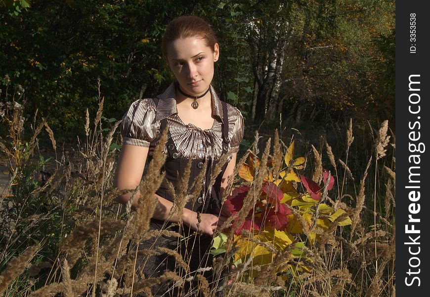 A girl with bouquet In autumn