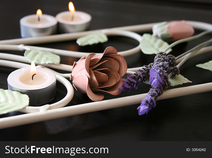 Wrought Iron flower patterns with fresh flowers and candles