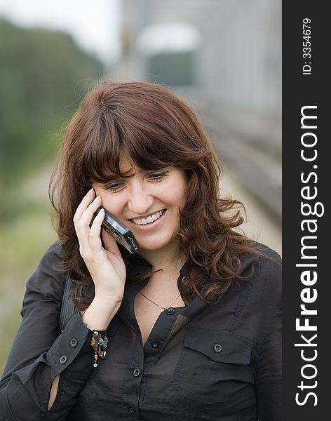 Young Lady talking by mobile phone